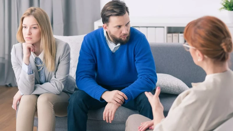 couple looking away from each other in a couples counseling session