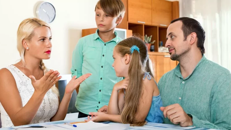 Parents speaking with their children about an important family change