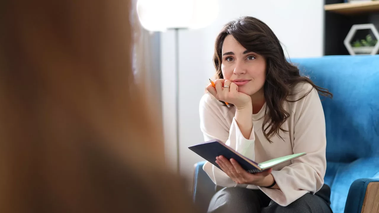 Female therapist talking to a client