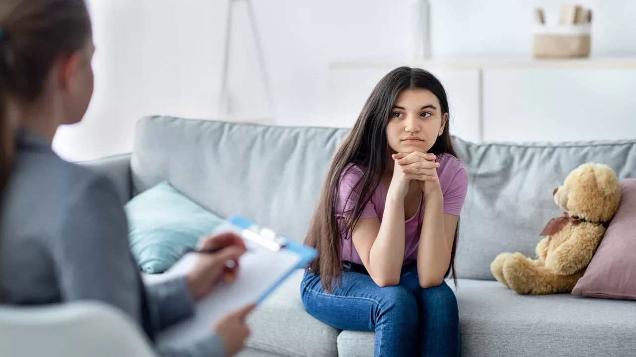 Young woman talking to a therapist