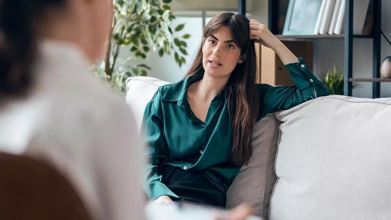 Female sitting on a couch in an office