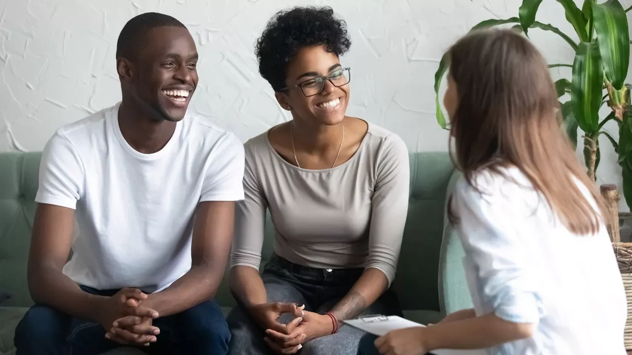 Young smiling couple in a therapist's office