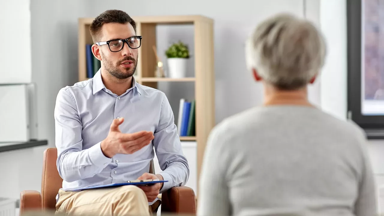therapist talking with a patient