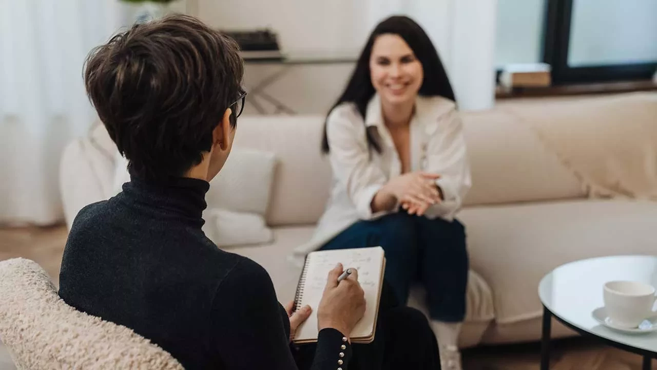 Female therapist sitting opposite to client
