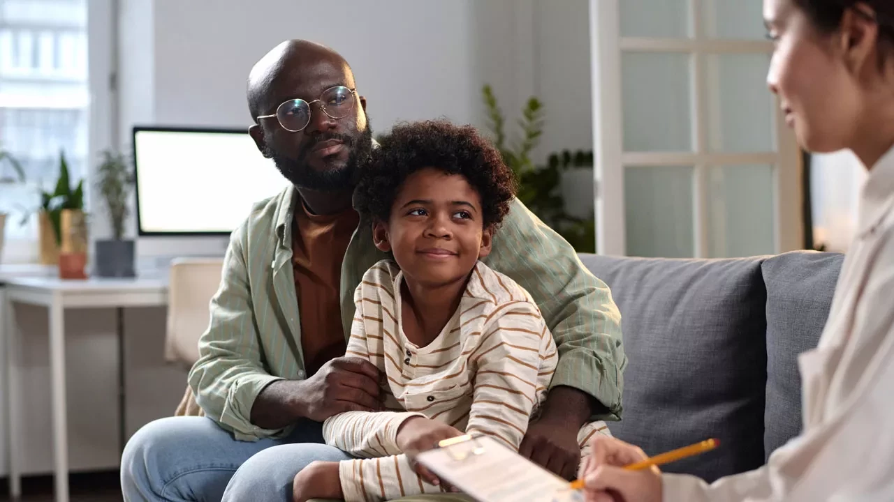 Father and son at a therapy session