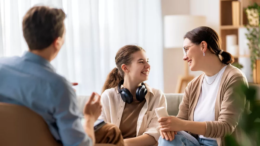 Mother and daughter smiling during therapy