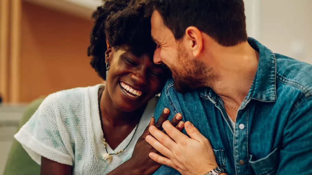 Couples smiling and holding hands