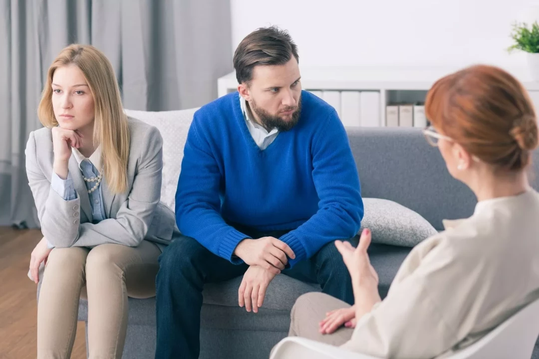 couple looking away from each other in a couples counseling session