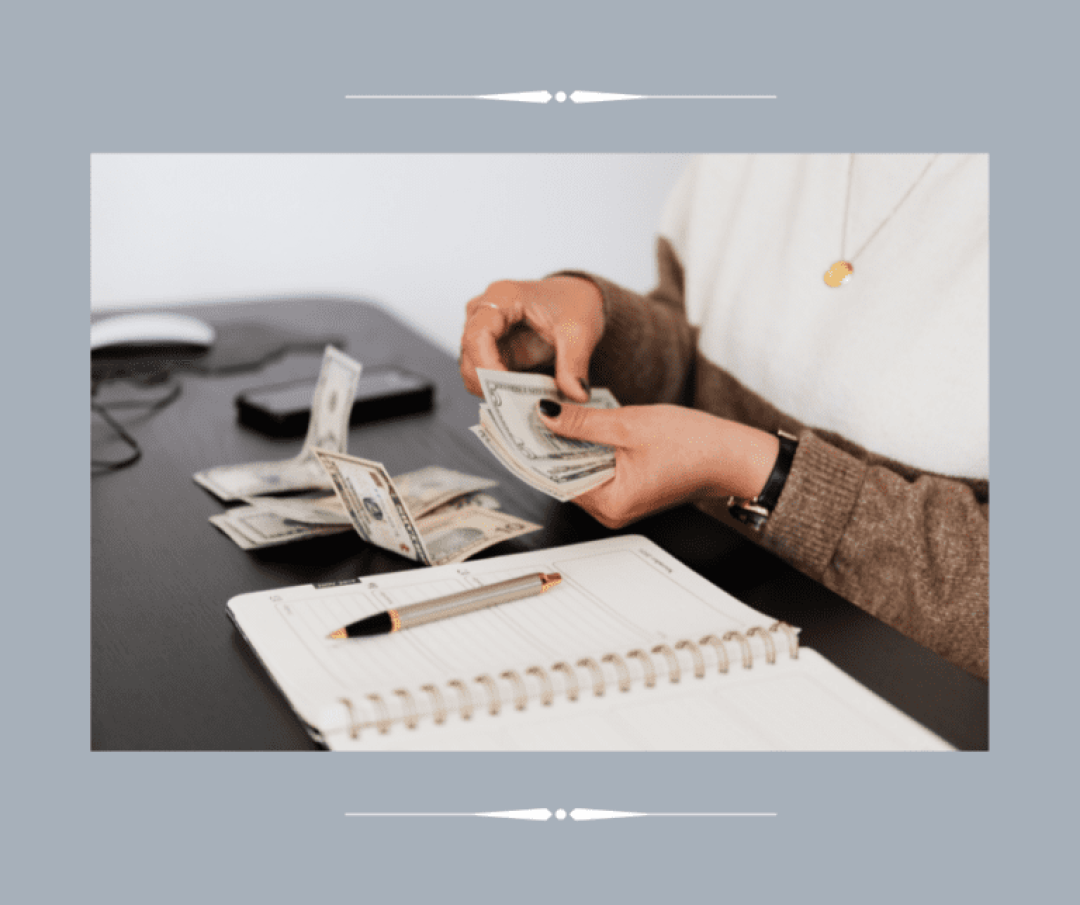 Woman counting money and taking notes