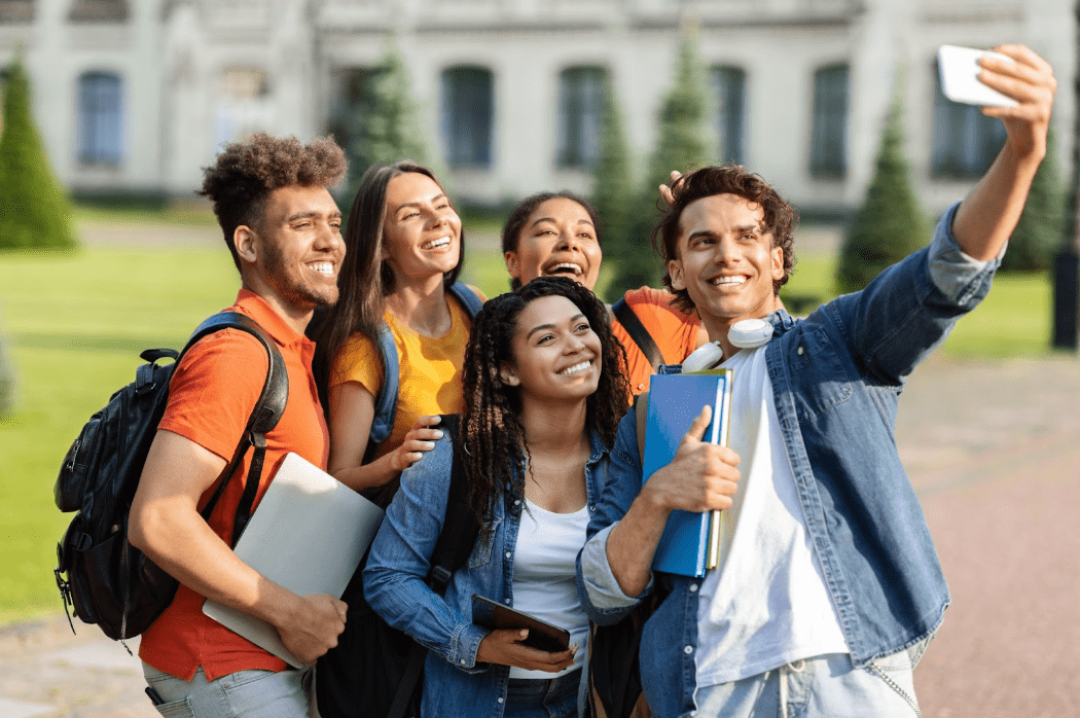 college students smiling for a selfie