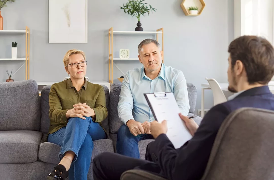 Couple talking with a therapist
