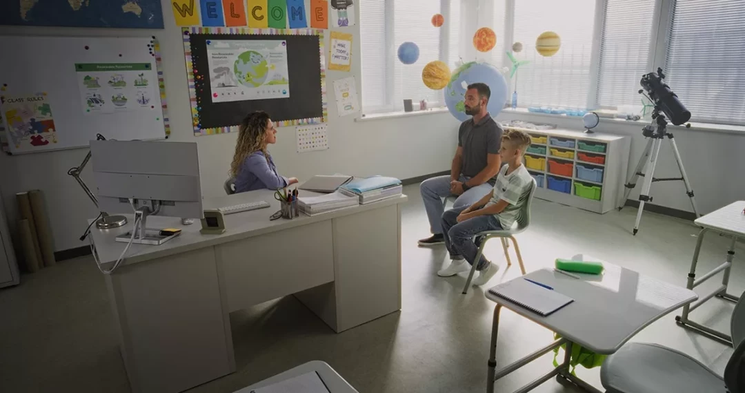 teacher meeting with a parent and student